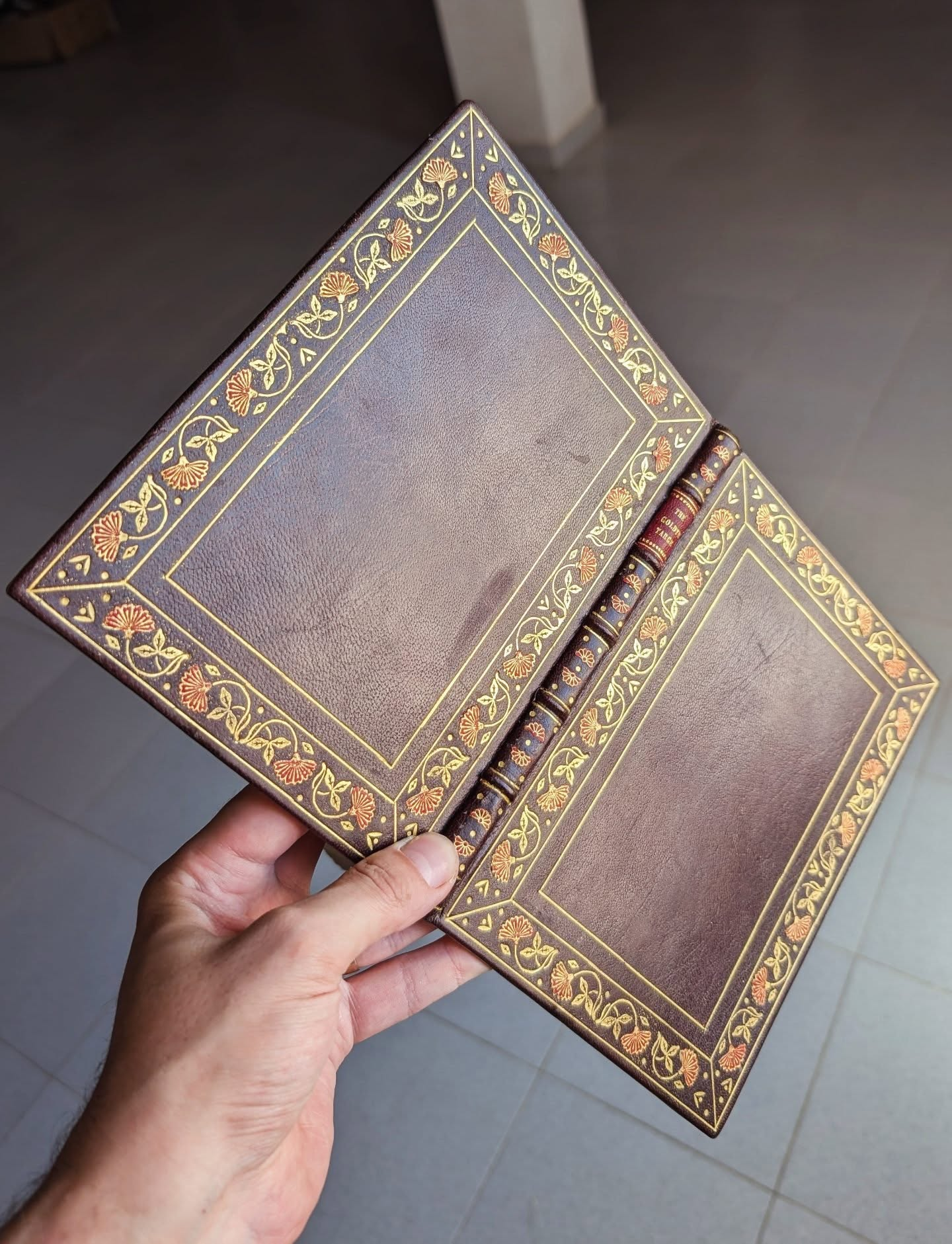 A binding featuring many onlays in the border